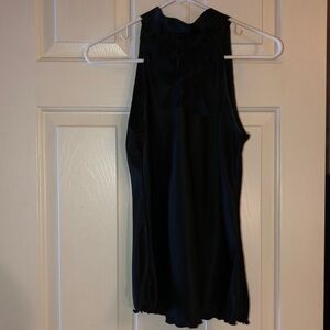 Cute A. Beyer black blouse to dress up any outfit.